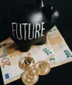 Close-Up Photo of Black Piggy Bank on Money