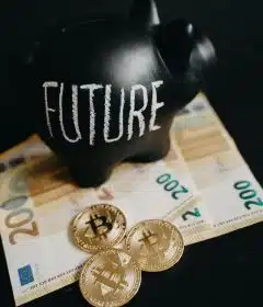 Close-Up Photo of Black Piggy Bank on Money